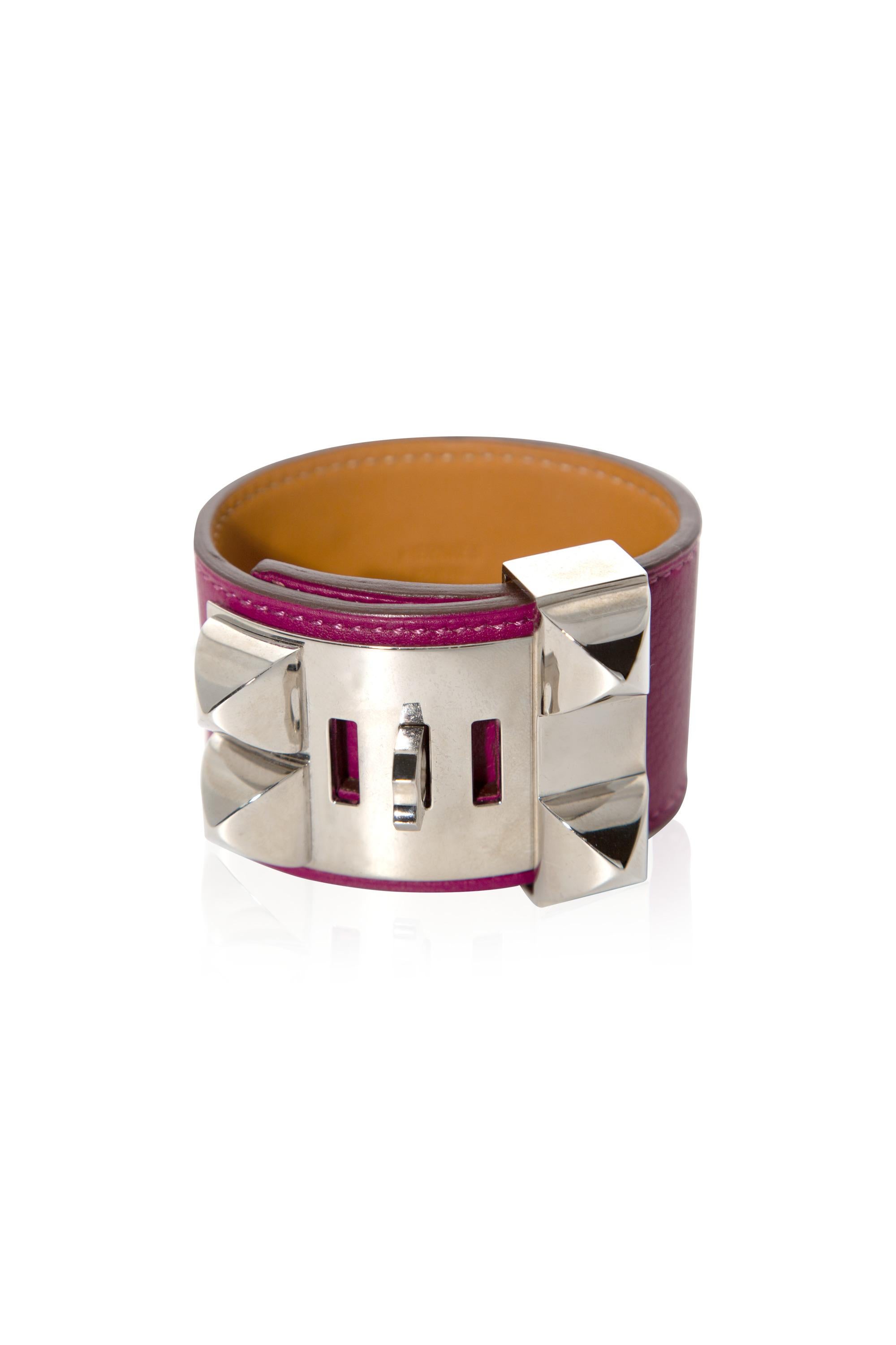 Hermès Collier de Chien Cuff is a fan favourite for being timeless with a rock’n’roll twist.

•This rare edition is crafted from tan calfskin leather
•Prune colour
•It is offset with palladium hardware
•Includes the bracelet’s signature studding and