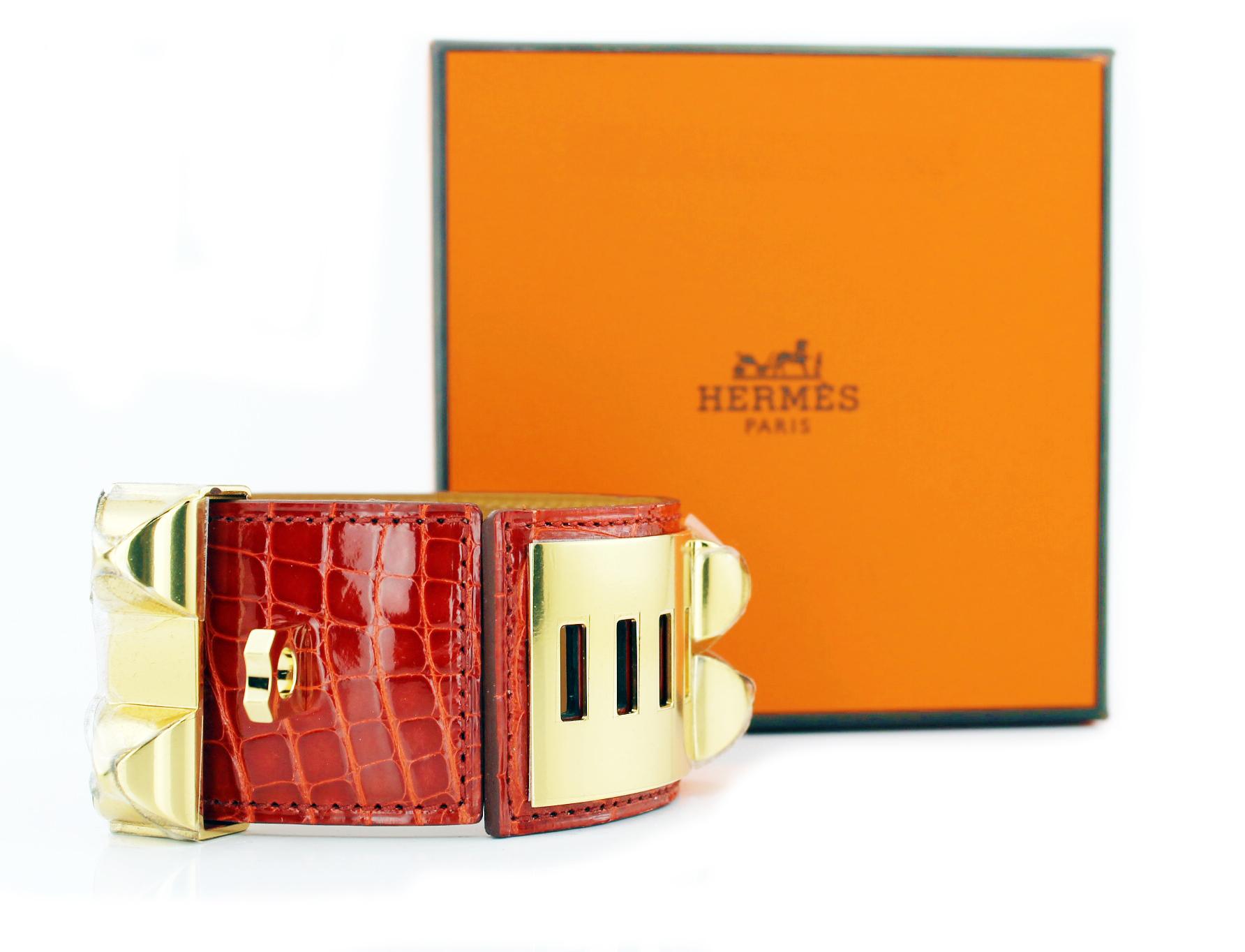 Hermes Collier De Chien Crocodile Cuff
Red crocodile cuff with gold plated pyramid studs and ring
New with stickers.
Original pouch and box
Size: Small
RRP £1,700