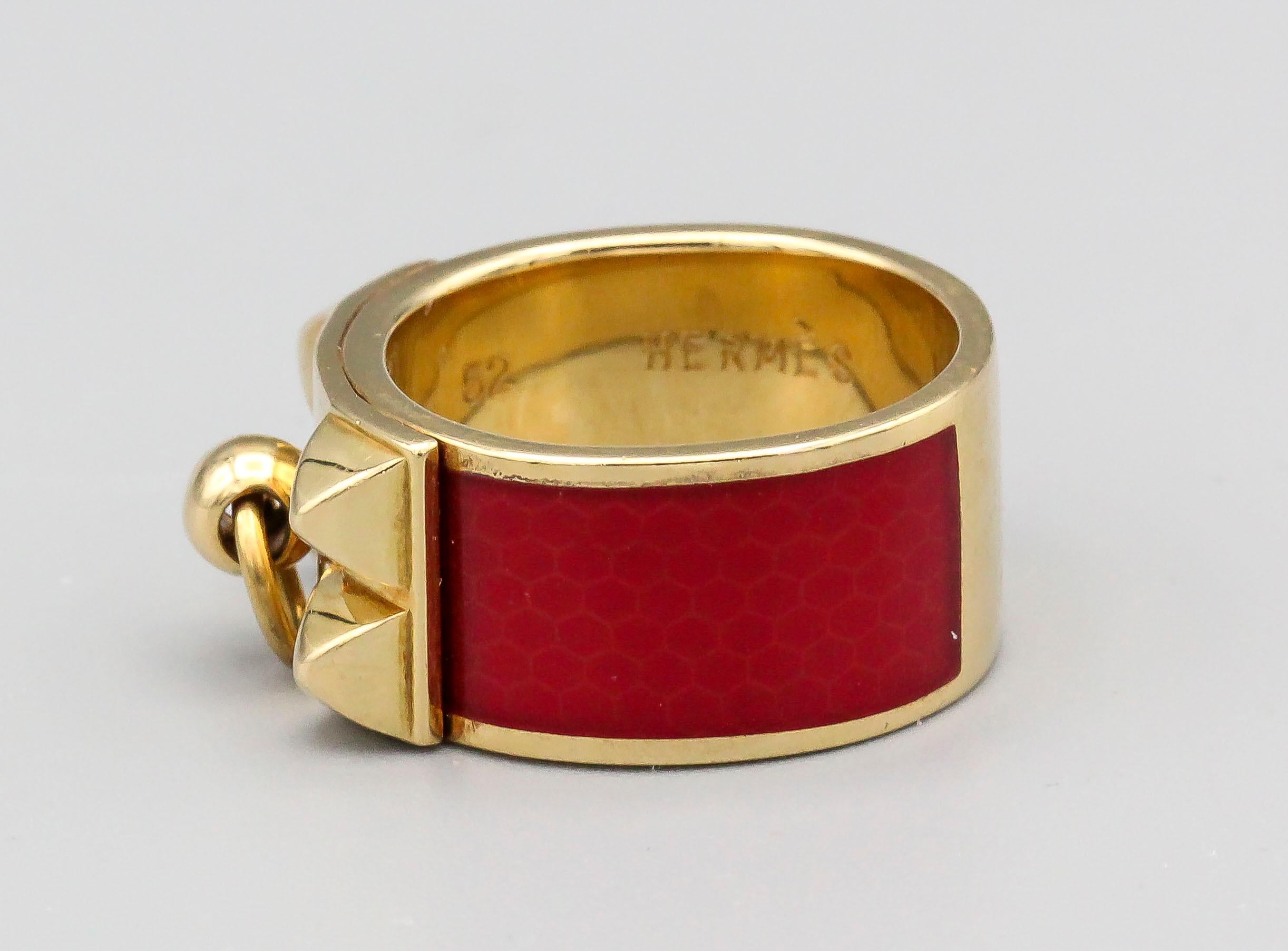Fine 18k yellow gold ring with rich red enamel by Hermes. From the Collier de Chien collection. Size 52.

Hallmarks: Hermes, 750, reference numbers, maker's mark, French 18K gold assay mark, 52.