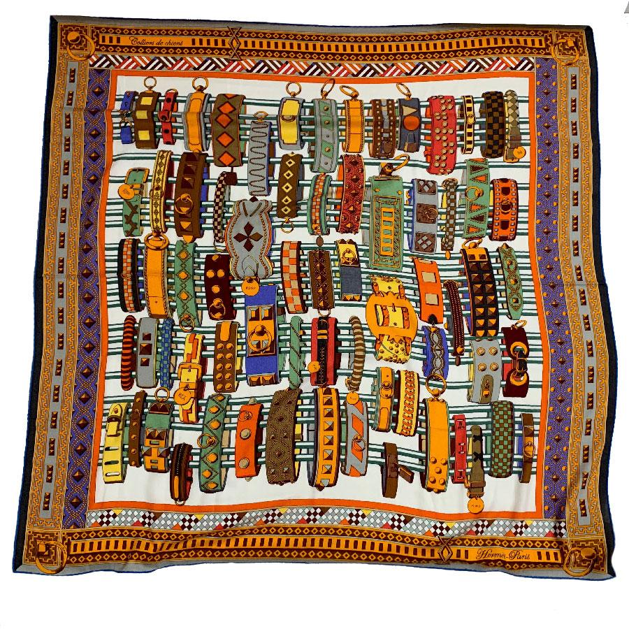 Superb HERMES Collier De Chien shawl in orange cashmere and silk. This is a reference to the jewelry of the brand such as the cuff. This HERMES Collier de chien shawl has been designed by Virginie Jamin. Its hot materials are very pleasant to wear