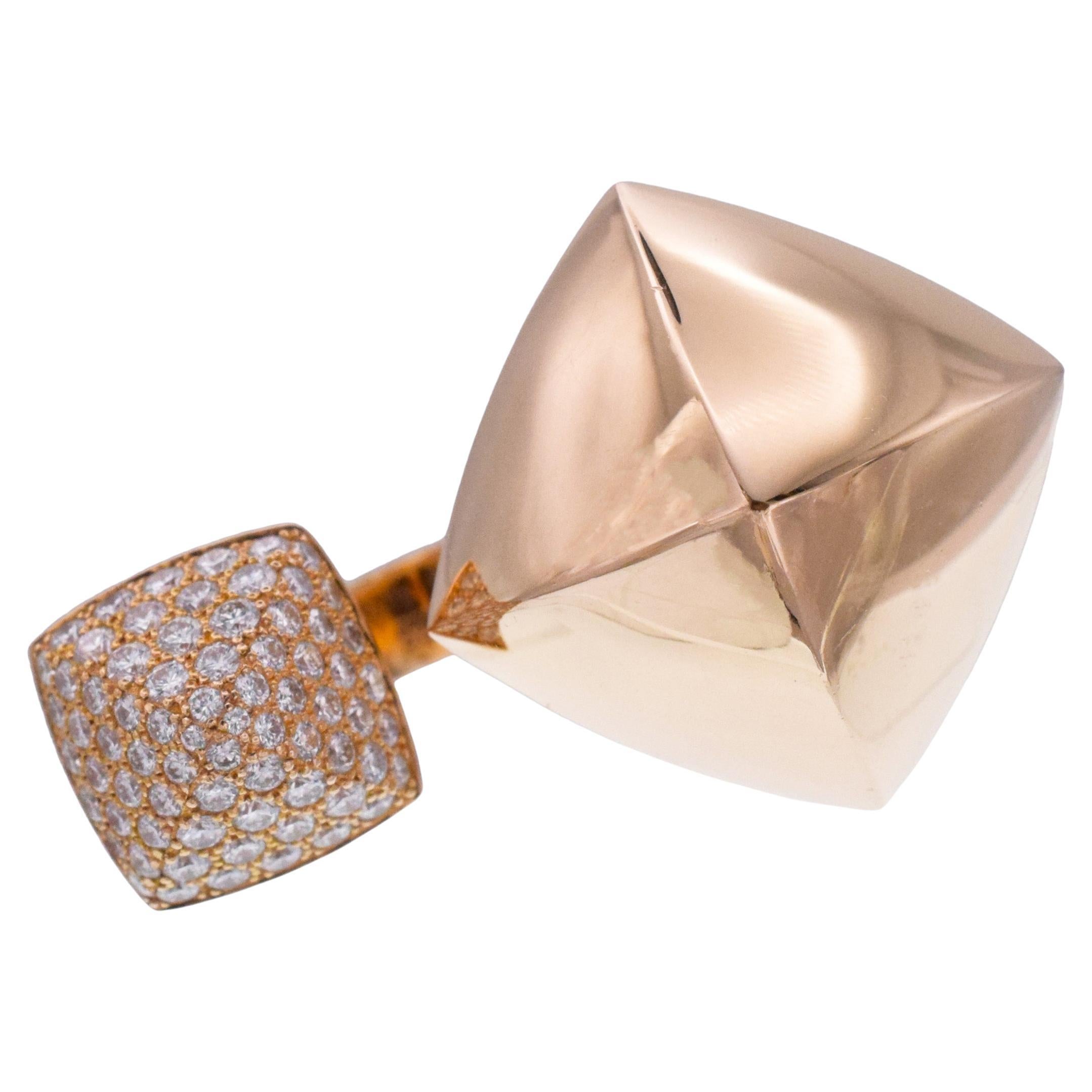 Hermes Collier de Chiens double Pyramid ring. The ring
features two pyramids, one in high polished gold, one pave set with 72 round brilliant cut diamonds with
total weight of 0.81 carats , Crafted in 18k rose gold. Inscribed: Hermes, 19APxxxxxxx,
