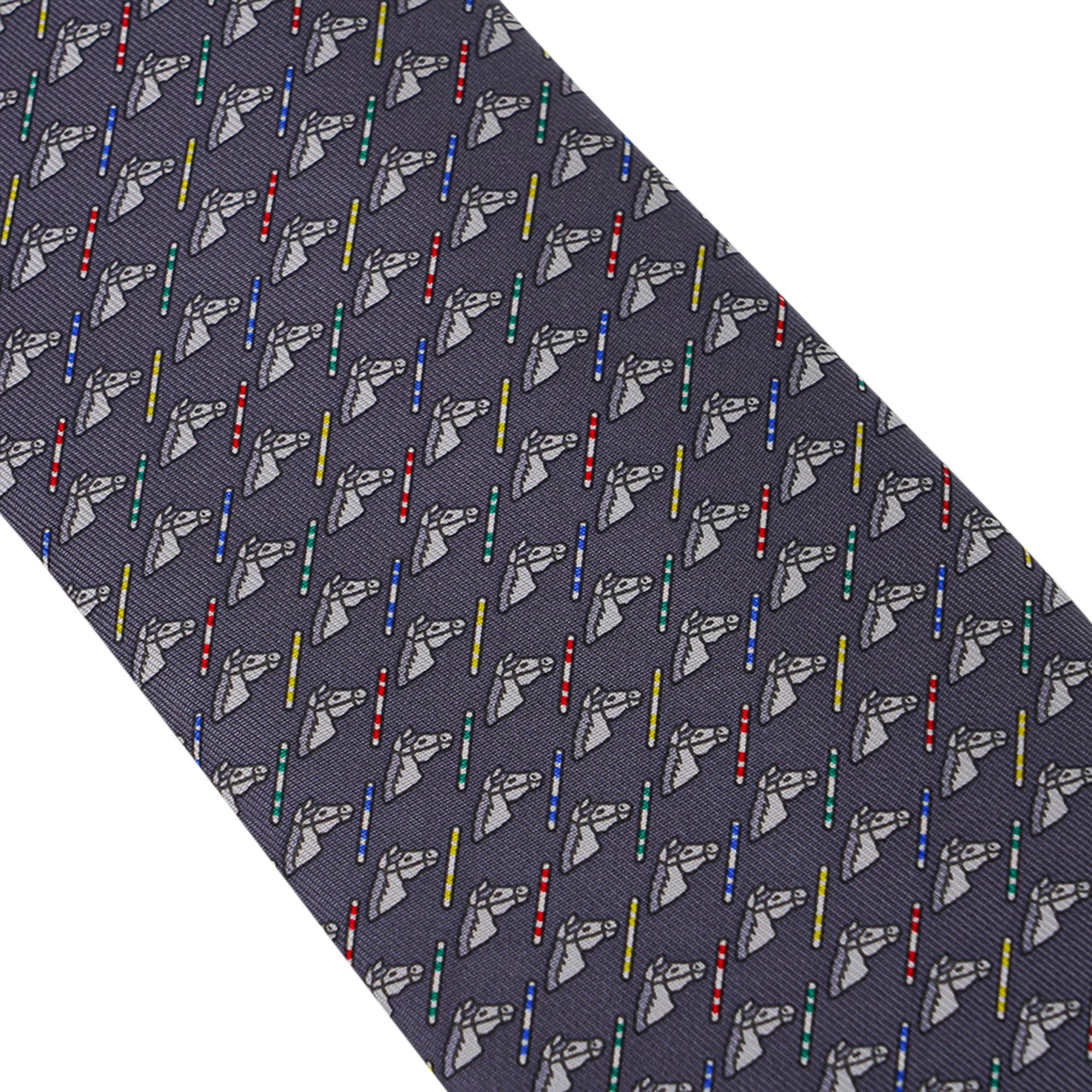 Mightychic offers an Hermes Colorful Jump Tie featured in Anthracite and Gris Clair.
Hand-sewn silk twill.
An equestrian surprise in the lining of the tie!
Designed by Philippe Mouquet
Made in France.
Comes with signature Hermes box. 
NEW or NEVER