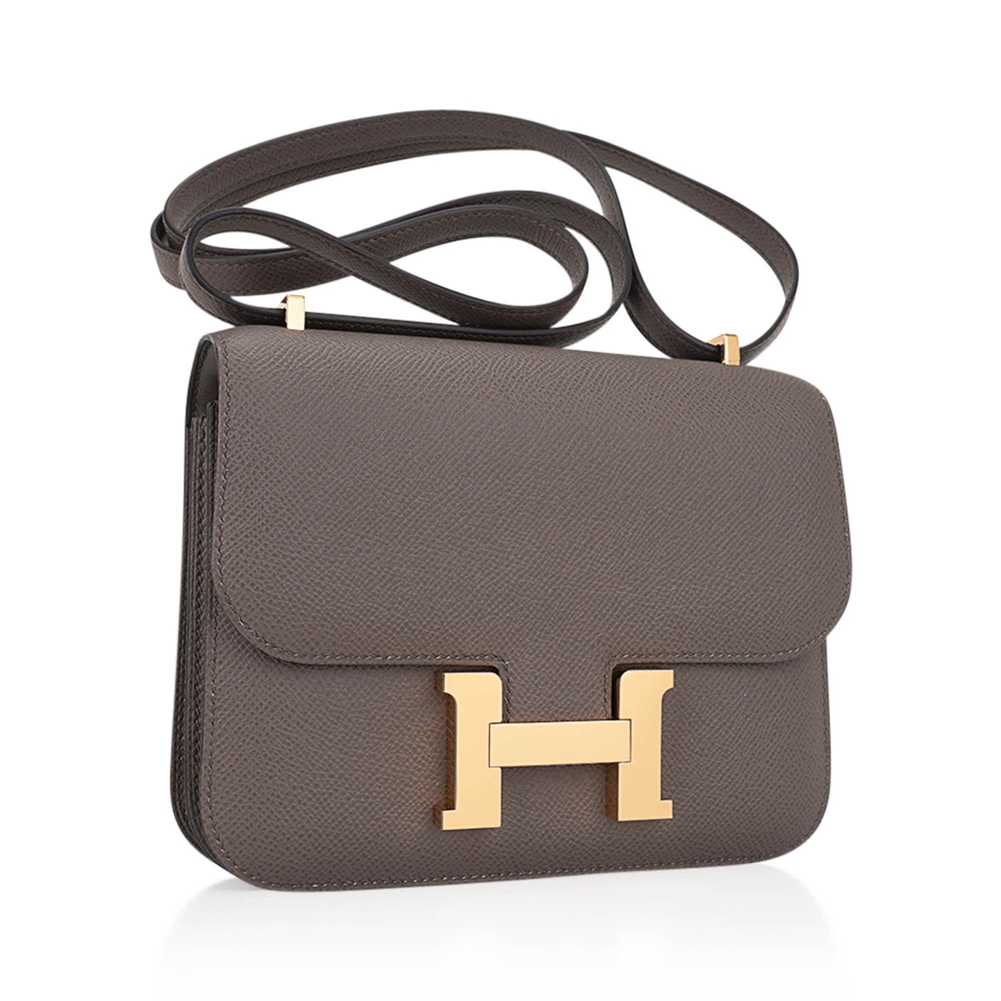 Mightychic offers an Hermes Constance 18 bag featured in Etain.
Epsom leather in warm neutral Gray accentuated with gold hardware.
A fabulous year round colour.
HERMES PARIS MADE IN FRANCE is stamped on front under flap.
Comes with Hermes sleeper