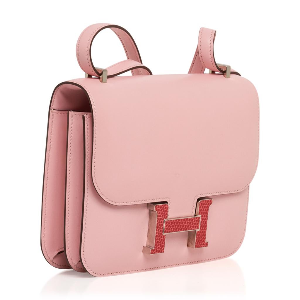 Guaranteed authentic Hermes Constance 18 bag featured in Rose Sakura with Bougainvillea Lizard buckle Kawaii Collection. 
Tadelakt leather.
Rich with Palladium hardware.
Carried by hand, over the shoulder, or even cross body! 
Comes with sleeper and