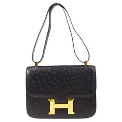 Hermès Constance 23 Schwarze Schultertasche aus Straußenleder mit exotischem Gold