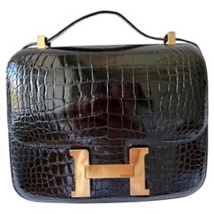 Hermès Constance 24 Noir/Schwarzes Alligator Mississippi Lisse Gold Hardware