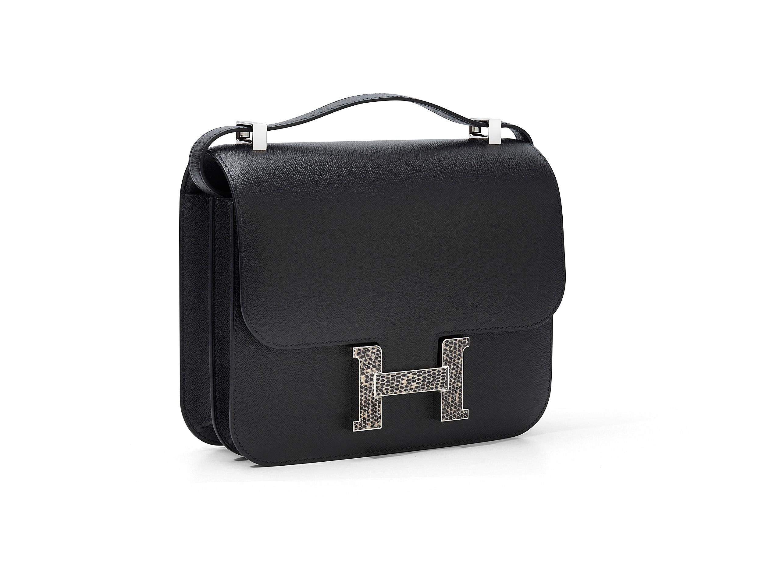 Hermès Constance 24 in noir and veau madame with lizard hardware. This bag is unworn and comes as full set including the original receipt and Cites.
Stamp Y (2020) 

