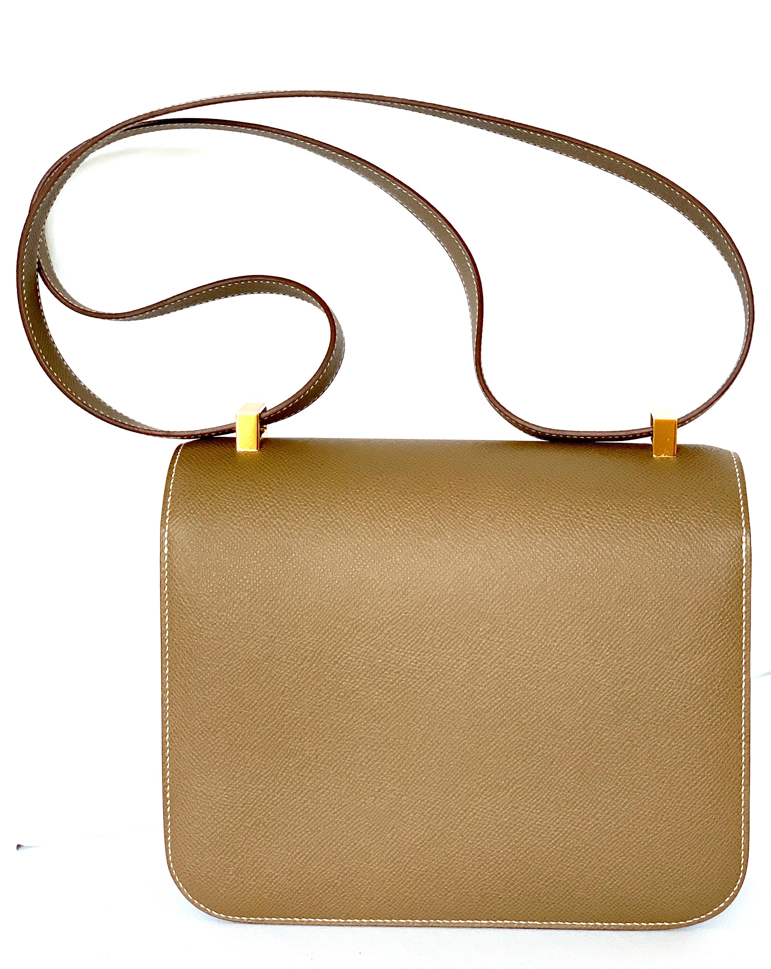 HERMES CONSTANCE BAG
Size 24cm
Etoupe Epsom Leather
Gold Hardware
Brand new 
Plastic on the Measurements
Length: 9 in
Width: 3 in
Height: 7.75 in
Drop: 17.25 in



Comes ready for gift giving, Hermes Box, Tissue, Felt 