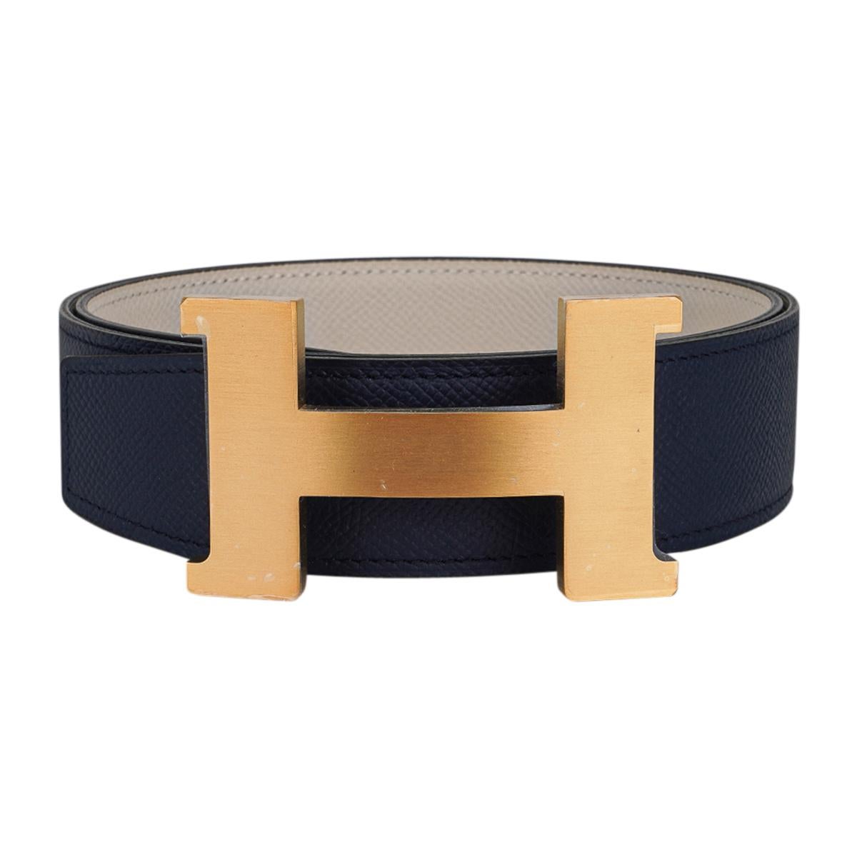Mightychic offers an Hermes Constance 42 belt features reversible Navy to Craie Epsom Leather.  
Fabulous over sized brushed Gold signature H buckle.  
Now a retired size, this is sure to become a collectors treasure. 
Signature HERMES PARIS MADE IN