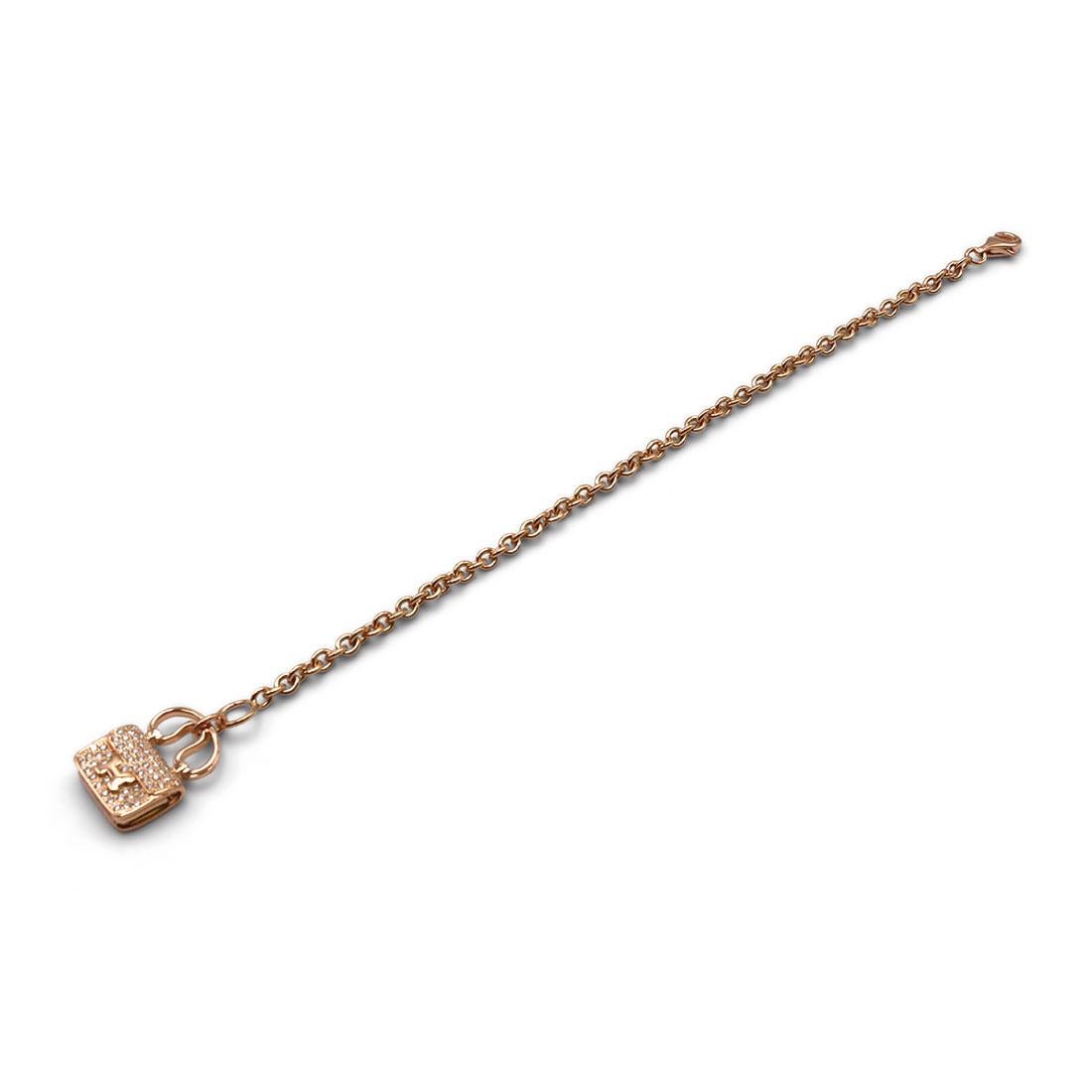 Authentic Hermès Constance Amulette bracelet crafted in 18 karat rose gold. The bracelet features a charm designed as an Hermès Constance handbag set with round brilliant cut diamonds carrying an estimated .58 total carat weight. Signed Hermes,