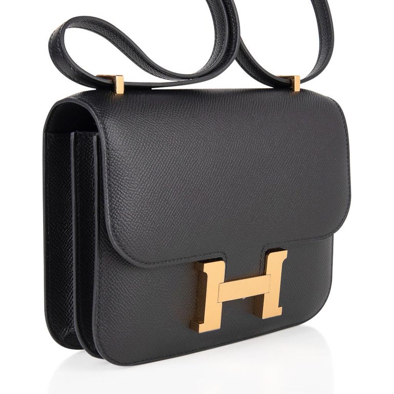 Guaranteed authentic Hermes Constance Mini 18 bag features classic Black with coveted gold hardware.
Perfect day to evening treasure!
HERMES PARIS MADE IN FRANCE is stamped on front under flap. 
Comes with signature Hermes box and sleeper. 
NEW or