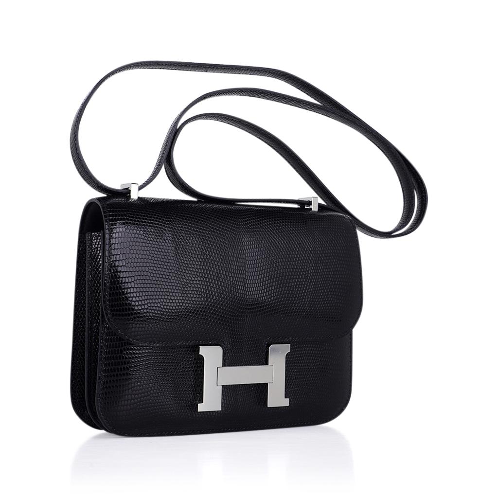 Mightychic offers an Hermes Constance 18 bag featured in jet Black Lizard.
Lizard saturates colour beautifully and gives this Black Constance fabulous depth. 
Fresh with palladium hardware.
Carried by hand, over the shoulder, or even crossbody!