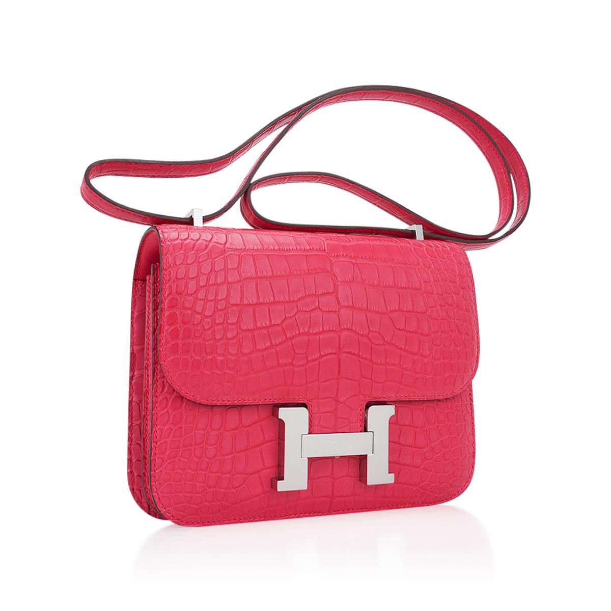 Mightychic offers an Hermes 18 Constance in richly saturated Rose Extreme Matte Alligator.
All grown up pink that is like a jewel in your hand.
Accentuated with Palladium hardware.
The effect is understated and fresh.
Hermes Paris Made in France is