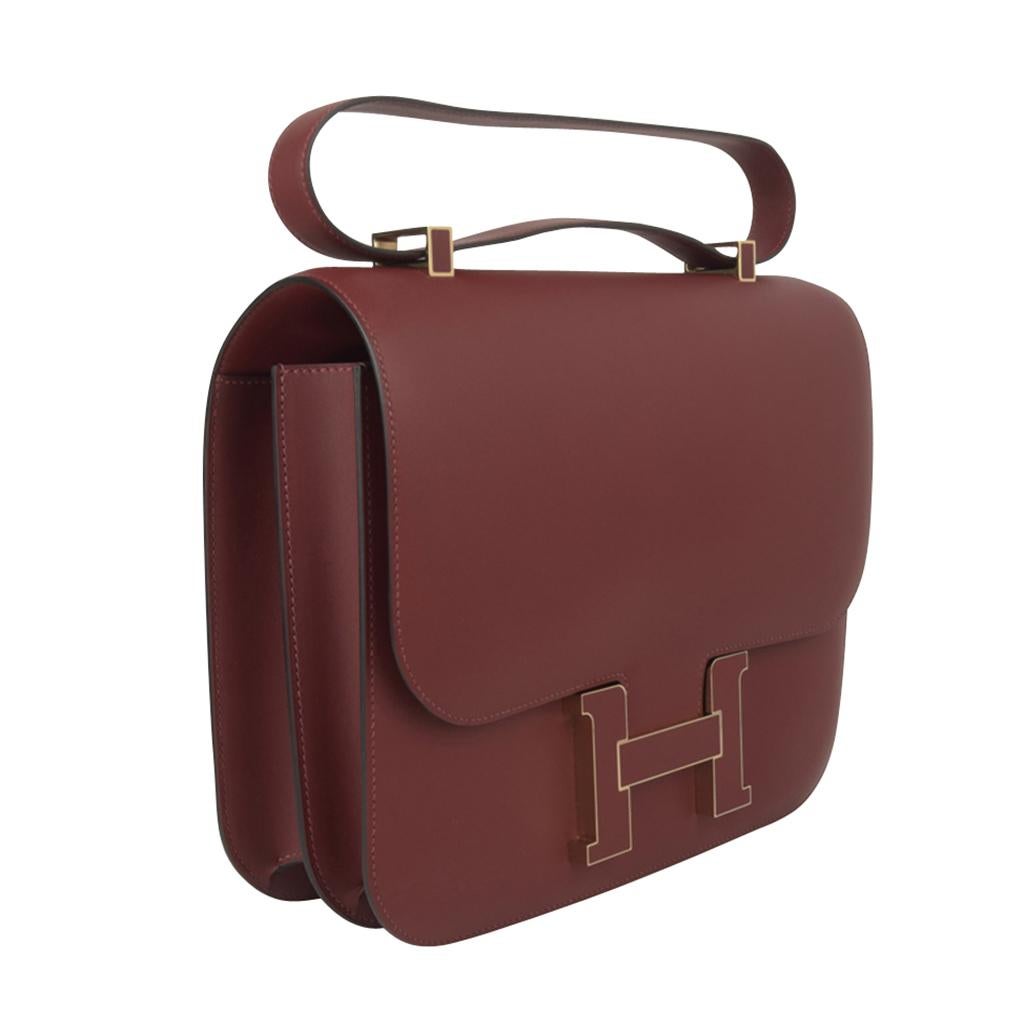 Mightychic offers a Limited Edition Hermes Constance Cartable 29 features deep rich Rouge H Sombrero leather.
Stunning inlaid leather logo clasp and shorter strap. 
Carried by hand as a satchel, or over the shoulder.
Hermes Paris Made in France is