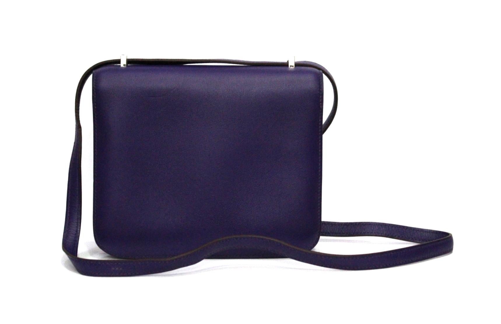 This Hermès Constance bag is featured in the Anemone color, which is a dark purple tone. This bag is made from smooth Swift leather and is accentuated by palladium hardware. This Constance bag features the signature 