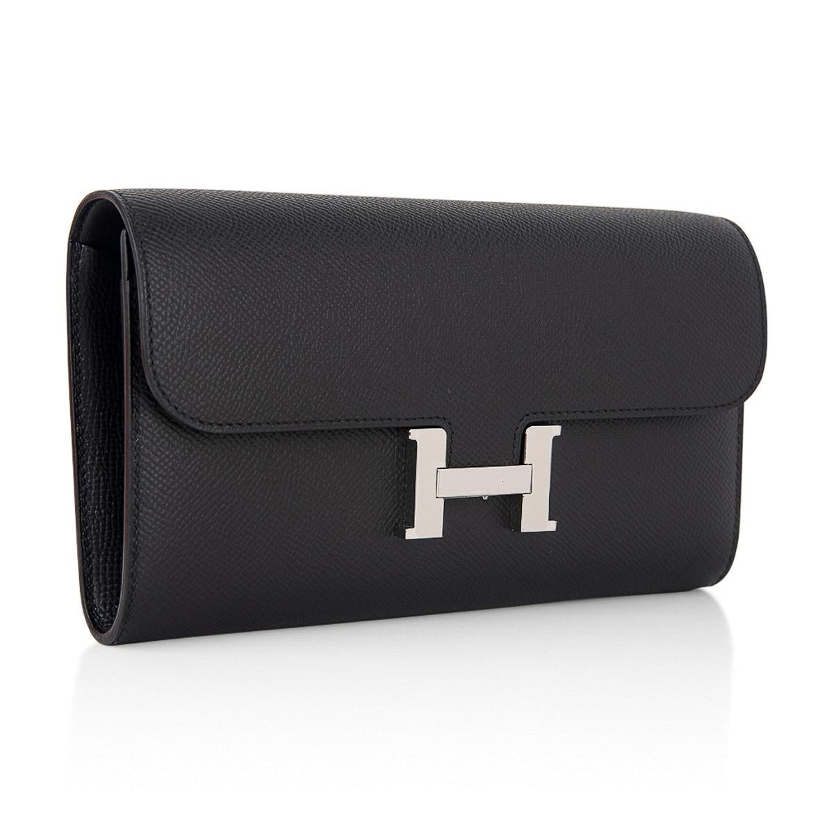Mightychic offers a coveted Hermes Constance Long To Go featured in classic Black.
Accentuated with Palladium hardware and Epsom leather.
The consummate Wallet on a Chain!
Detachable strap allows you to carry the wallet / bag as a clutch.
Classic