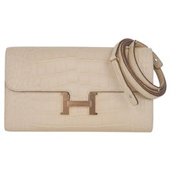 Hermès - Portefeuille Constance Long To Go en alligator mat et finitions métalliques dorées Vanille