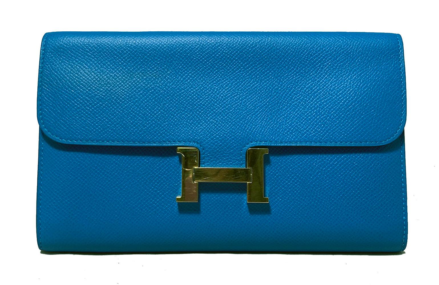 Hermes Constance Long Wallet Blue Epsom in excellent condition. Blue epsom leather exterior trimmed with shining gold signature H hardware along front side. Lift latch top flap closure opens to a matching blue interior with 12 credit card slots, 2