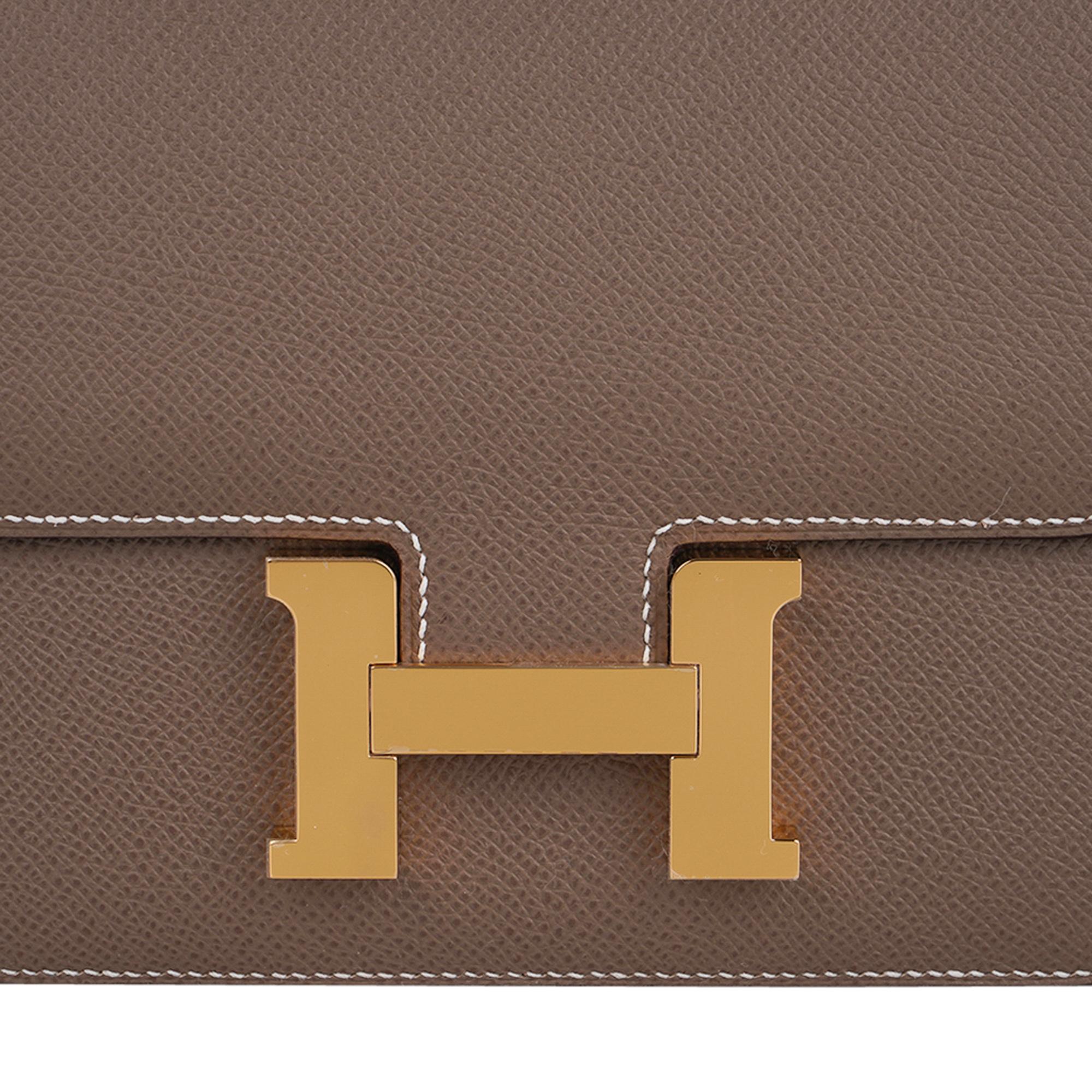 Mightychic offers a guaranteed authentic Hermes Constance 18 mini bag featured in neutral Etoupe.
Rich with gold hardware.
HERMES MADE IN FRANCE is stamped on front under flap.
Comes with signature Hermes box and sleeper.
NEW or NEVER WORN.
The