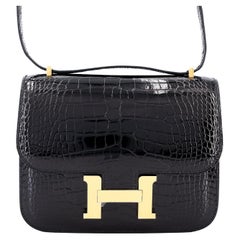 Hermès Constance Mini in pelle di alligatore nera con finiture dorate