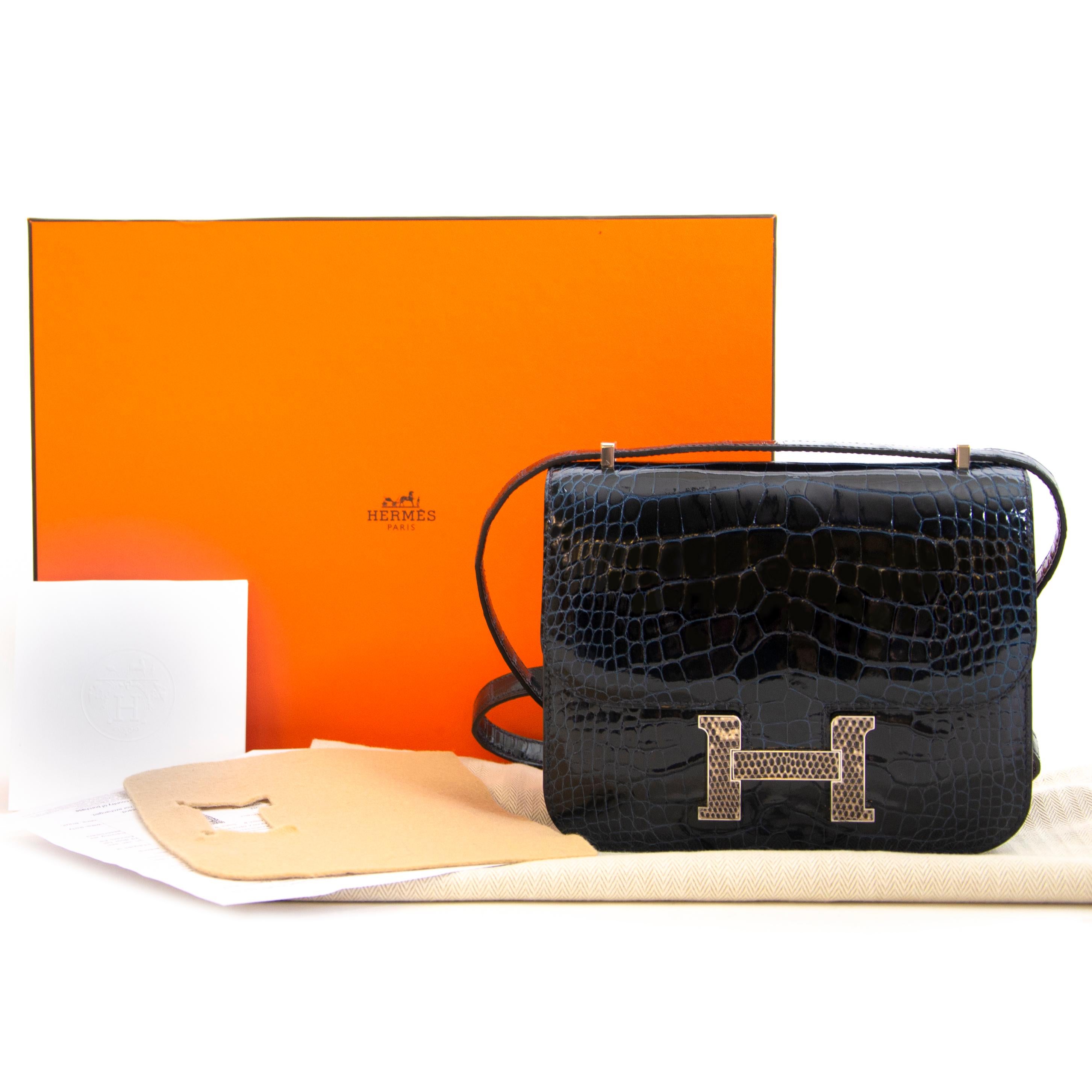 This stunning Hermès Constance Mini Marquete Alligator Mississippiensis Lisse Bleu Marine / Ombre is BRAND NEW and comes with full set. This stunning Constance bag has all the features the iconic bag is known for, with a little extra touch on the H