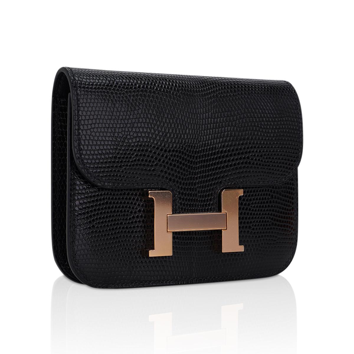 Mightychic offers an Hermes Constance Slim Wallet Belt bag featured in Black Lizard.
This Hermes wallet is stunning with accentuated Rose Gold hardware.
The wallet includes a removable zipped change purse and has two (2) credit card slots.
Rear belt