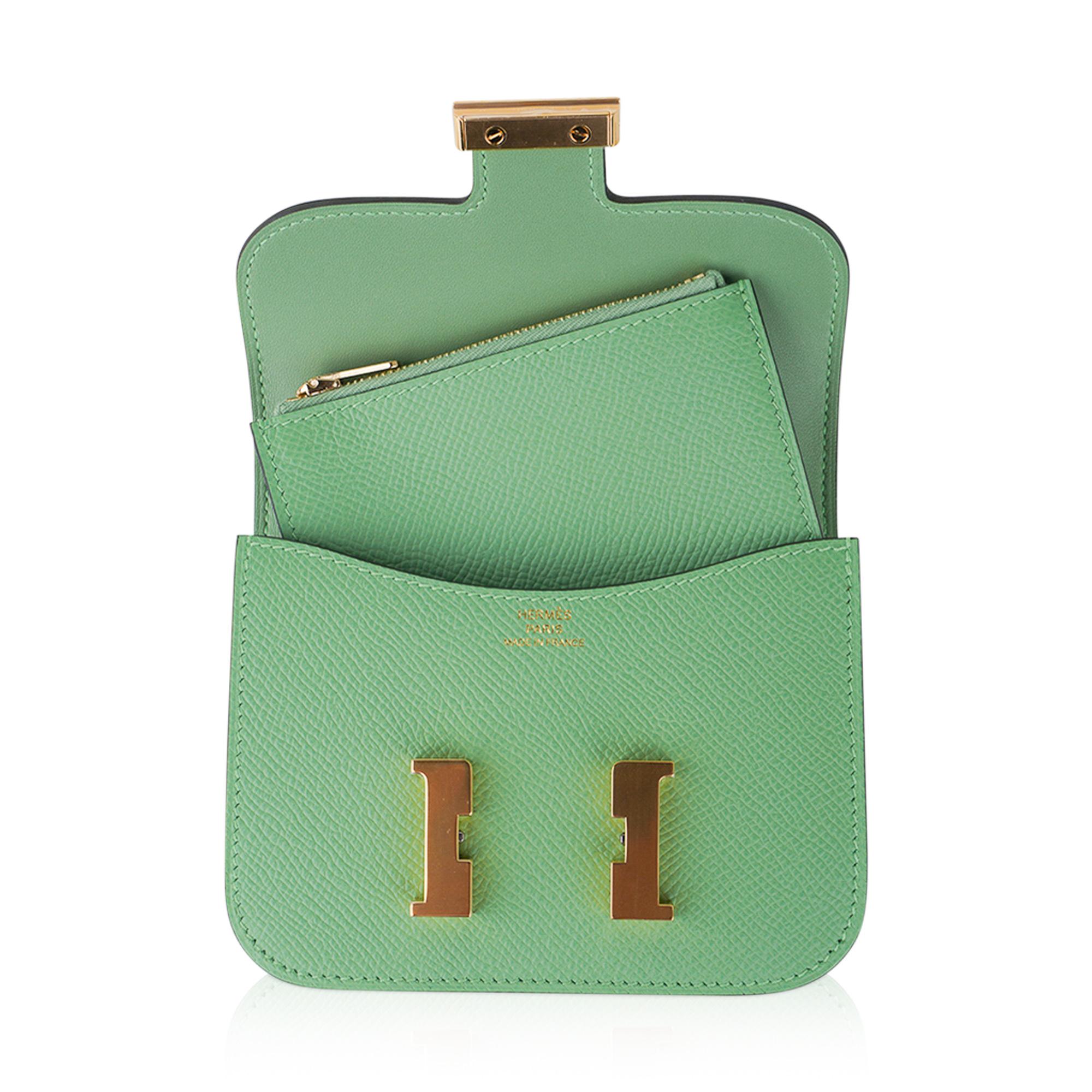 Mightychic offers an Hermes Constance Slim Wallet Belt bag featured in fresh Vert Criquet.
This Hermes wallet is stunning with coveted Gold hardware in epsom leather.
Includes removable zipped change purse and 2 credit card slots.
Rear belt loop