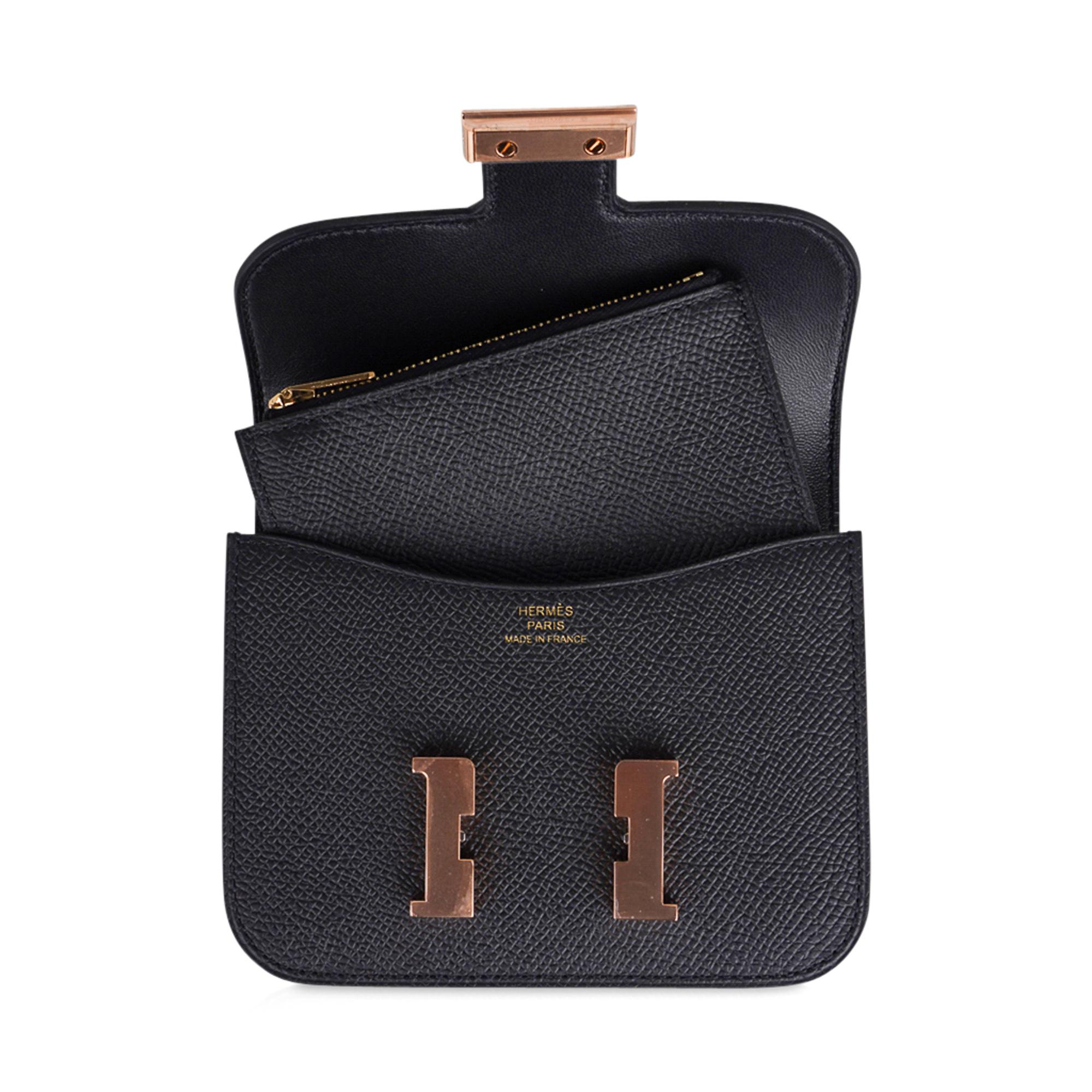 Mightychic offers a guaranteed authentic Hermes Constance Slim Wallet Belt bag featured in classic Black.
This Hermes wallet is stunning with coveted Rose Gold hardware.
Includes removable zipped change purse and 2 credit card slots.
Rear belt loop