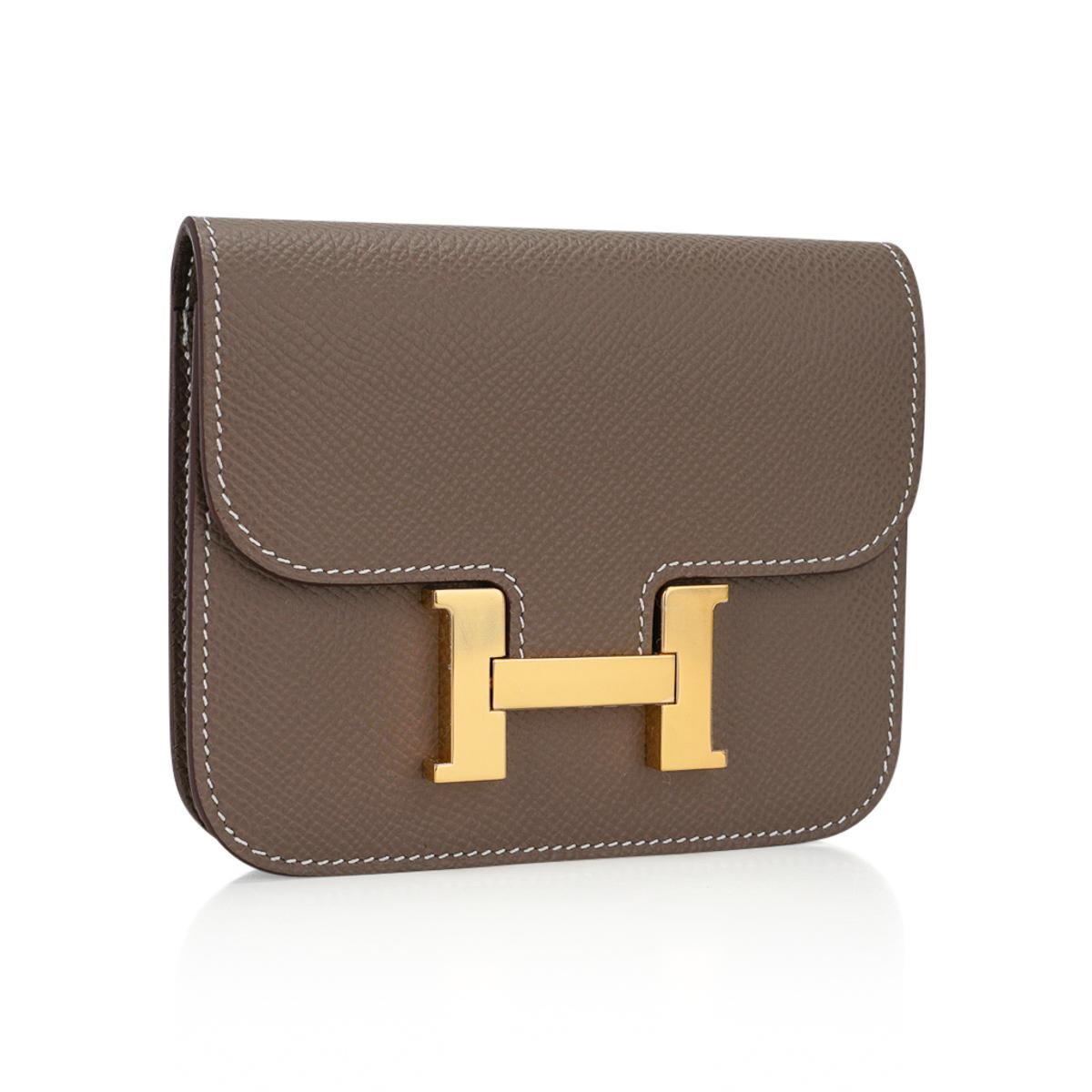 Mightychic offers an Hermes Constance Slim Wallet Belt bag featured in neutral Etoupe.
This Hermes wallet is stunning with coveted Gold hardware in Epsom leather.
Includes removable zipped change purse and 2 credit card slots.
Rear belt loop allows