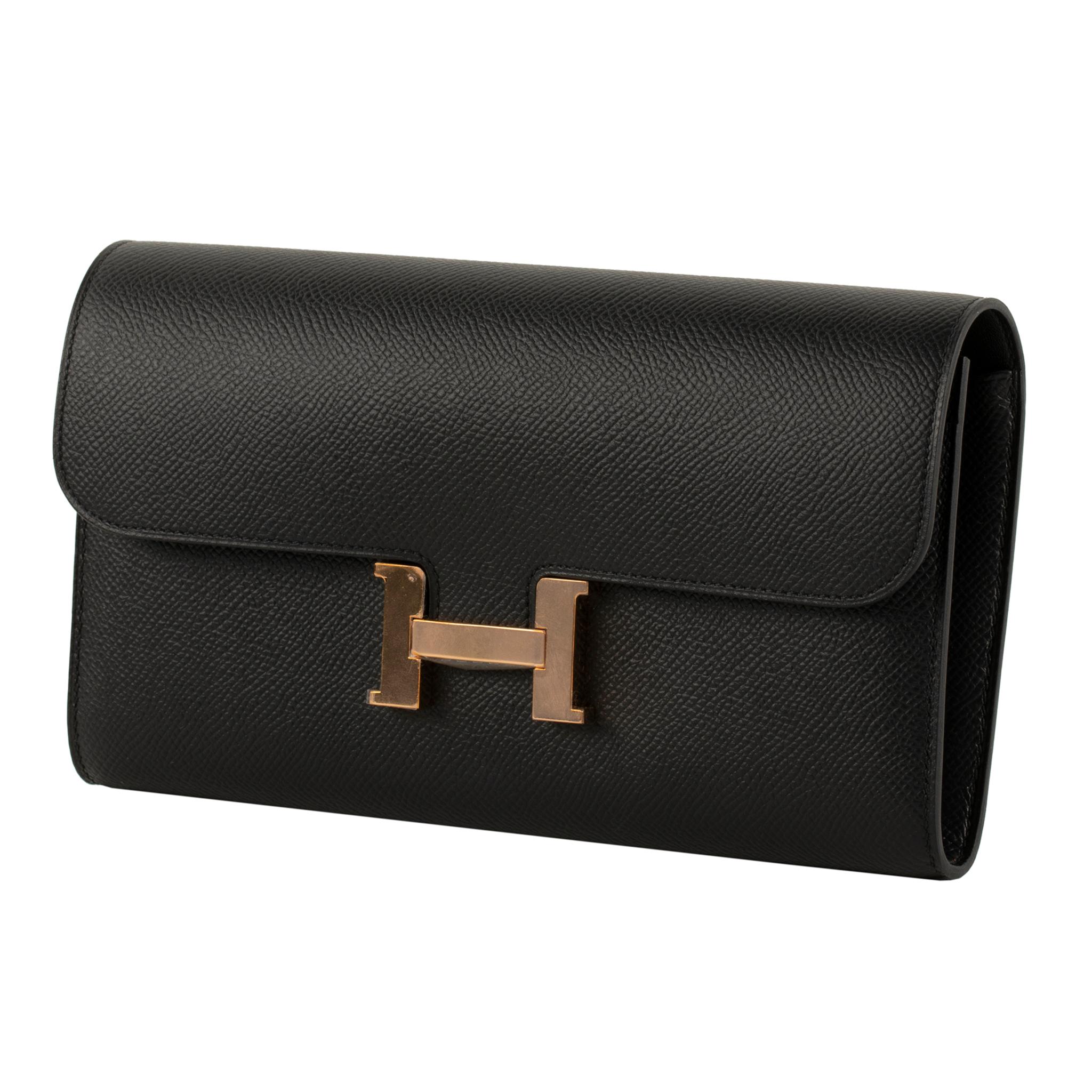 The Hermes Constance Wallet in Black Epsom Leather with Rose Gold Hardware is a stylish and refined accessory. Crafted with meticulous attention to detail, this wallet showcases the classic Black Epsom Leather, adorned with the luxurious Rose Gold