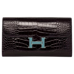 Cartera Hermes Constance Prunoir y Azul Saint Cyr Aligátor Brillante Palladium Hardw