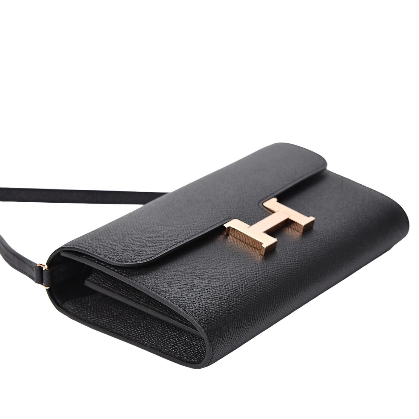 This is an authentic HERMES Epsom Constance Wallet To Go in Black. This chic wallet is crafted of fine Epsom calfskin leather in black. The wallet features a front flap, strap, and signature H rose gold plated press lock. This opens to a partitioned