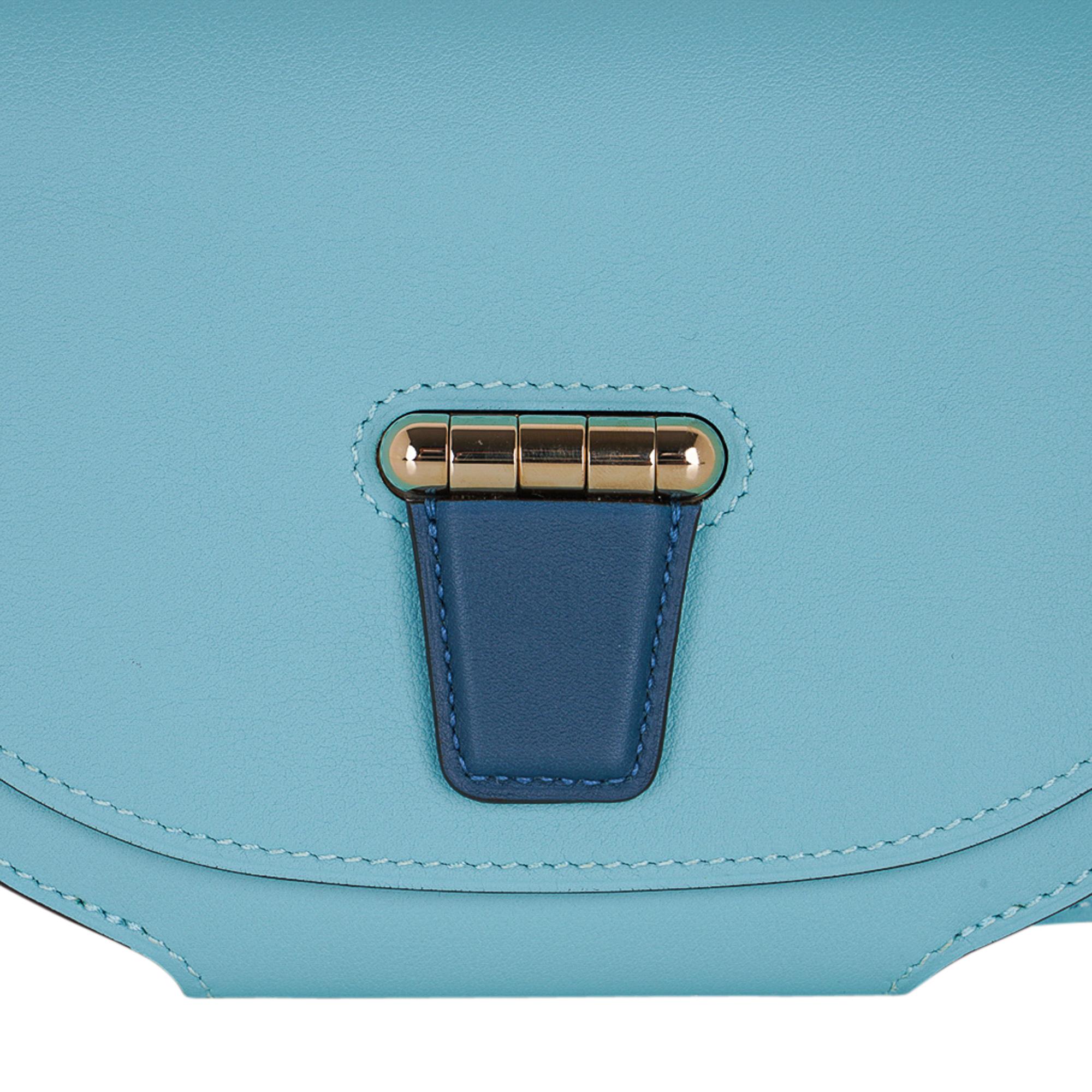 Mightychic offers an Hermes Mini Convoyeur bag featured in Blue Atoll and Blue Colvert.
Lush with Gold hardware and richly saturated Swift leather.
This versatile bag can be worn on shoulder, crossbody, or with removable leather strap, as a