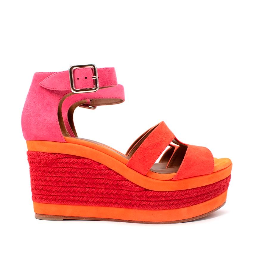 Hermes Coral & Pink Platform Espadrille Wedges 
 

 -These chic sandals are crafted in pink and coral tones with layers of woven jute rope around the wedge. 
 These feature a cross-over Hermes H strap. 
 These are excellent sandals with the