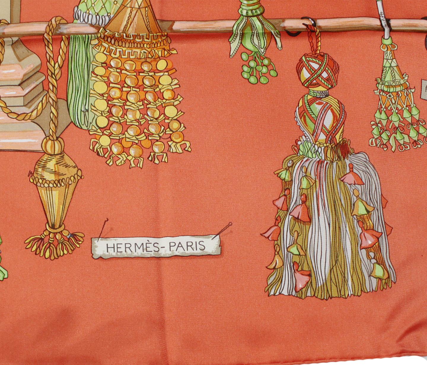 Hermes Passementerie scarf featuring coral, pink and green,  tassels, hand rolled hem.  Passementerie was designed by Francoise Heron and first issued in 1960.   At the beginning of the 1960s, Robert Dumas, then president of Hermès, was entranced by