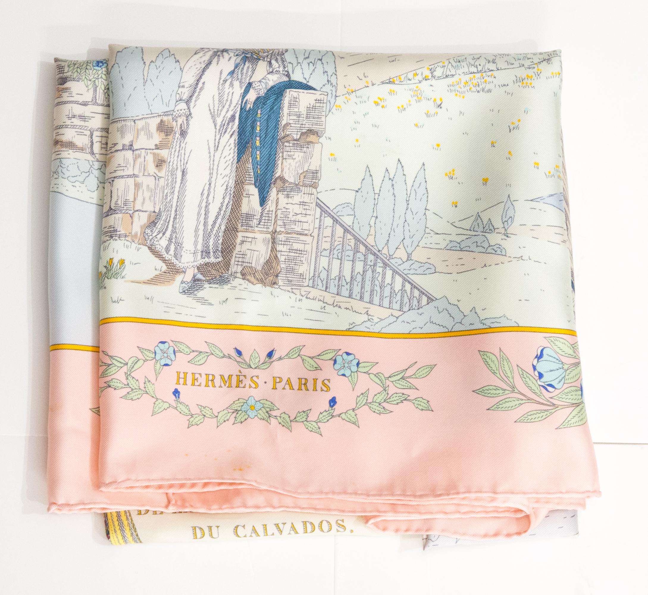 Hermès “Costumes des Départements de la Seine Inferieure du Calvados de la Manche et de l’Orne » by Z. Pauwels silk scarf featuring a pink border, a Hermès signature. 
Circa 1991
In good vintage condition. Made in France.
35,4in. (90cm)  X 35,4in.
