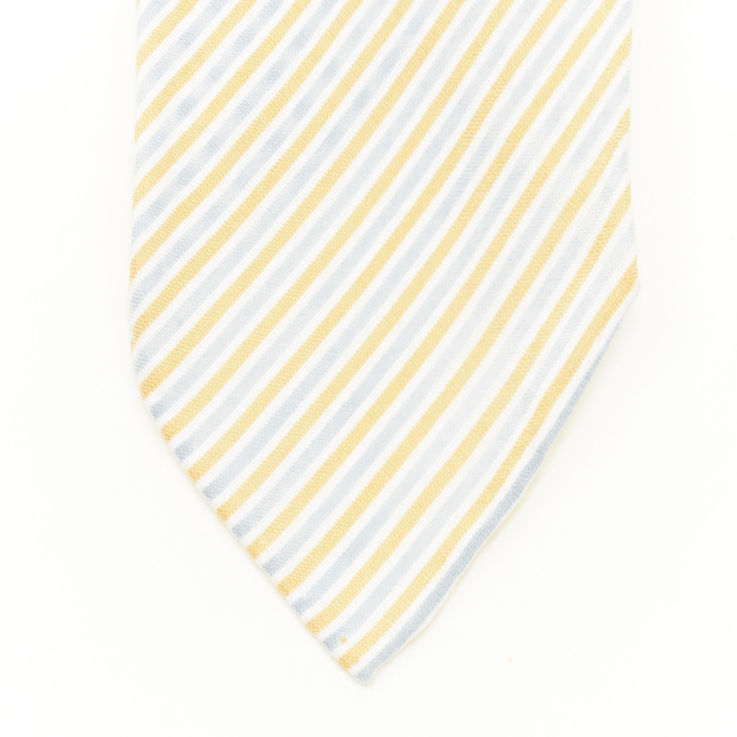 HERMES cotton silk blend orange grey striped summer tie 
Reference: JNWG/A00024 
Brand: Hermes 
Material: Cotton 
Color: Orange 
Pattern: Striped 
Estimated Retail Price: US $260 
Made in: France 

CONDITION: 
Condition: Very good, this item was