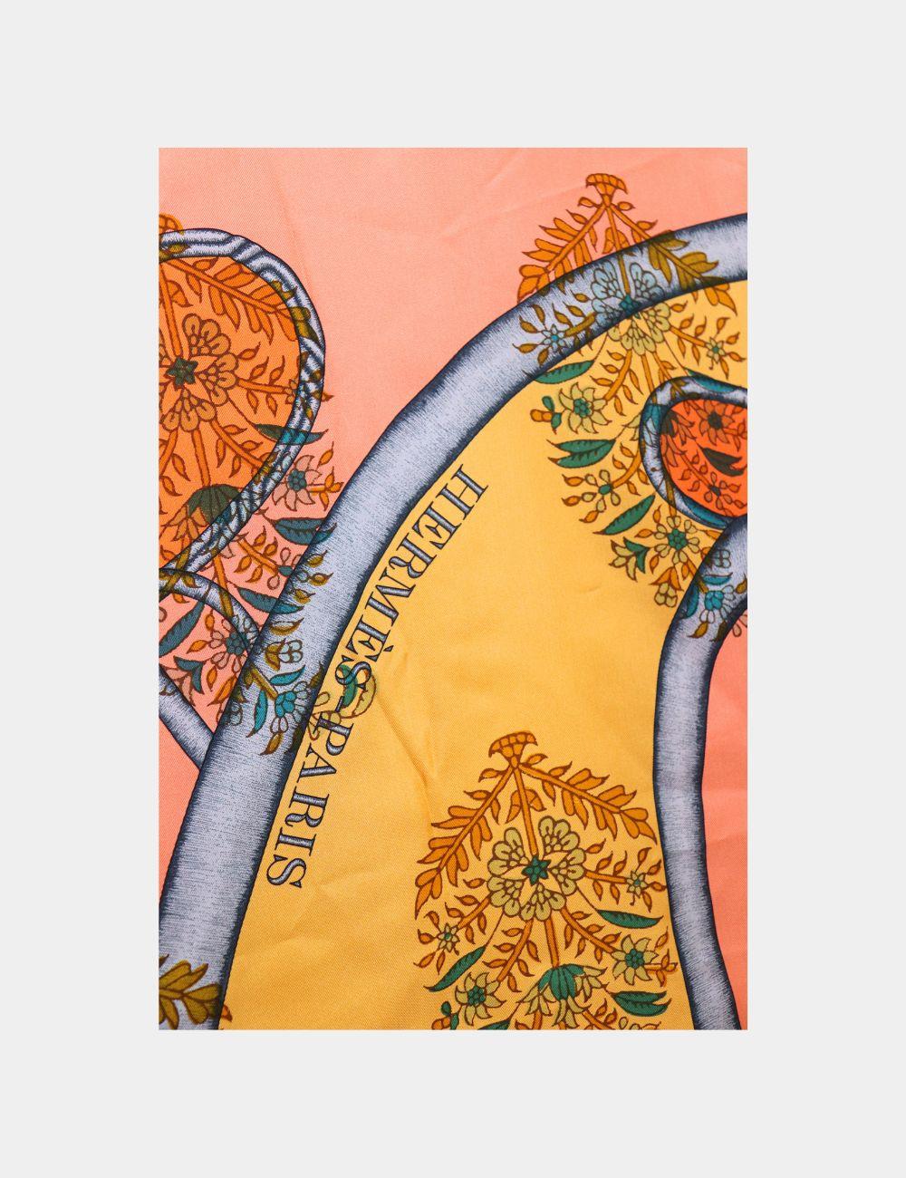 Wrap yourself in timeless elegance with this Hermès Silk Scarf featuring the brand’s signature “Cheval” equestrian print in vibrant orange, gold, and turquoise tones. Crafted from luxurious pure silk, this square scarf is a true collector’s piece,