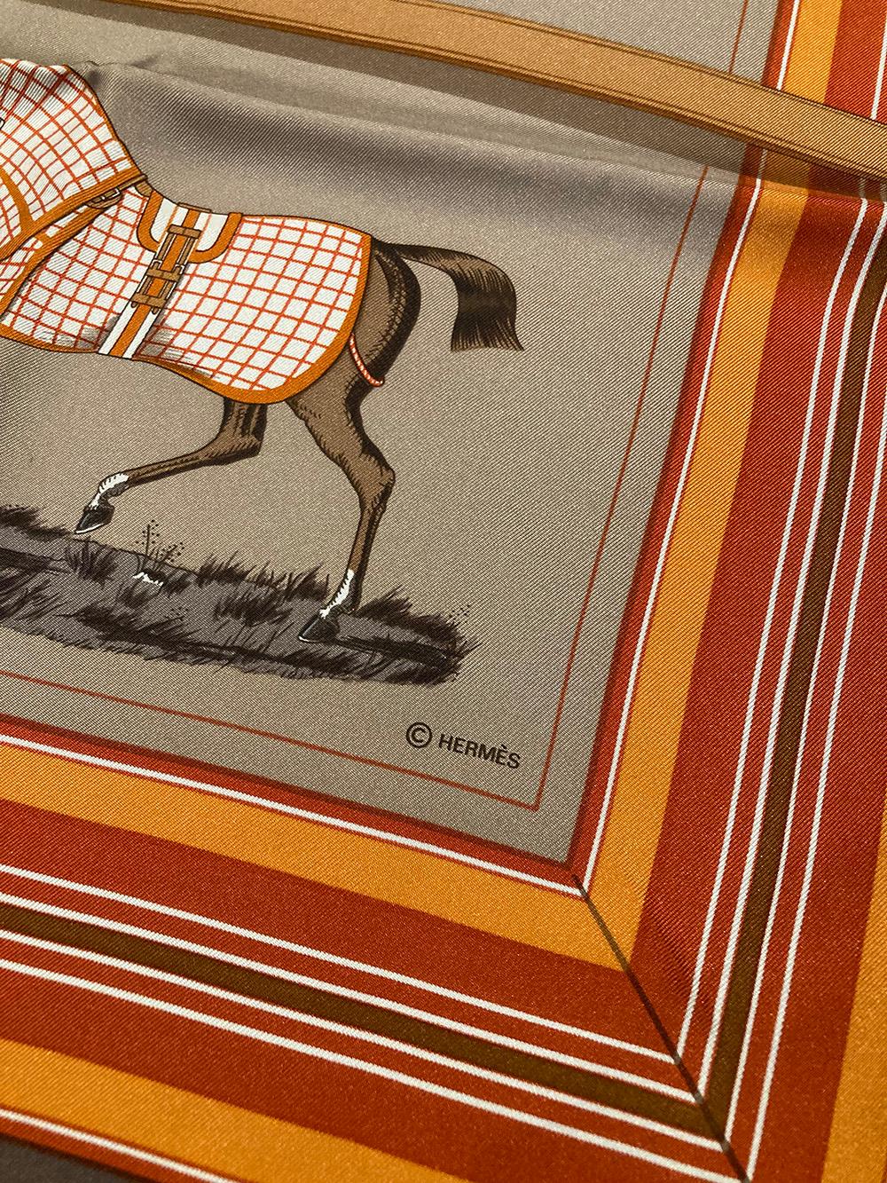 BEAUTIFUL Hermes couvetures et tenues de jour silk scarf in brown, tan, gray and orange. excellent condition no stains smells or fabric pulls.  Original silk screen design c1974 by Jacques Eudel features an array of show horses dressed in various