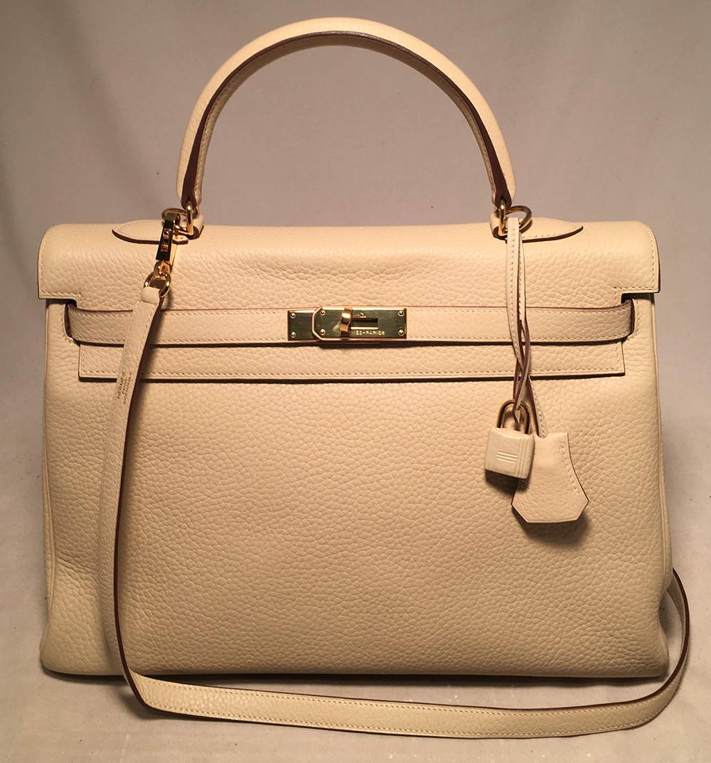 Hermes Parchemin Taurillon Clemence Leather Kelly 35 in excellent condition. Cream Parchemin beige clemence leather exterior trimmed with gold hardware. Signature front double strap turn lock closure opens to a matching cream leather interior that