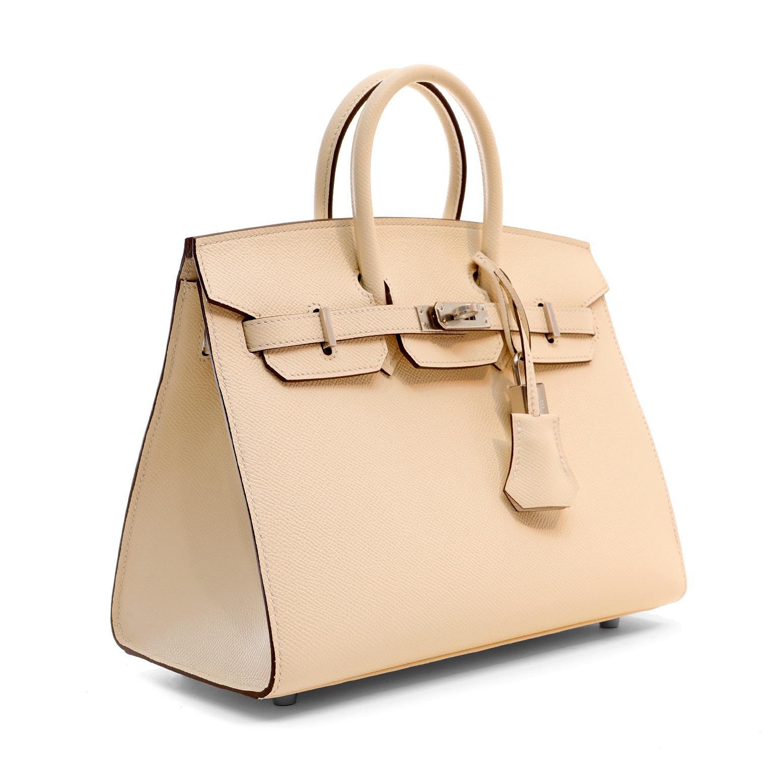 This authentic Hermès Cream Epsom 25 cm Sellier Birkin is in pristine unworn condition; the protective plastic is still intact on the hardware.    Considered the ultimate luxury item, the Hermès Birkin is stitched by hand. Waitlists are commonplace