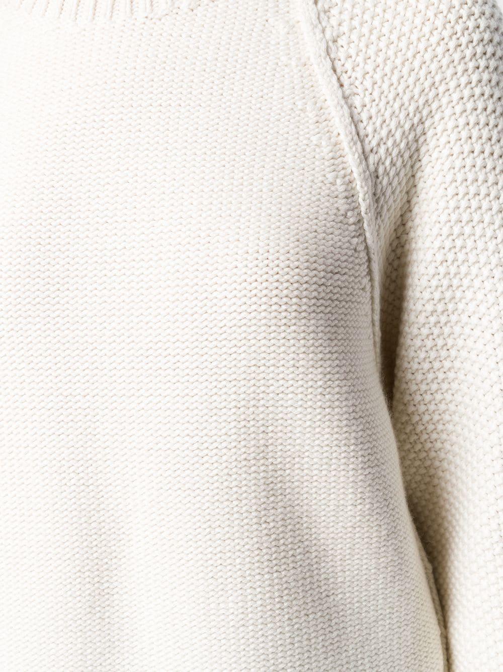 Crafted from an intricate blend of soft cream cashmere and cotton, this Hermes knit jumper features a ribbed round neck, long wide sleeves, side slits and a ribbed hem, perfect for long winter days.

Colour: Cream

Composition: 64% Cashmere, 36%