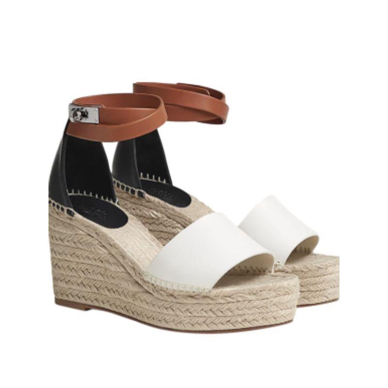 Hermes Cream Leather and Jute Tipoli Espadrille Wedges

- Supple leather toe and heel panels
- Woven jute body 
- Ankle strap with PHW turn clasp fastening 
- Small wedge heel 

Materials:
Jute
Leather 

Made in Spain 

9.5/10 excellent condition