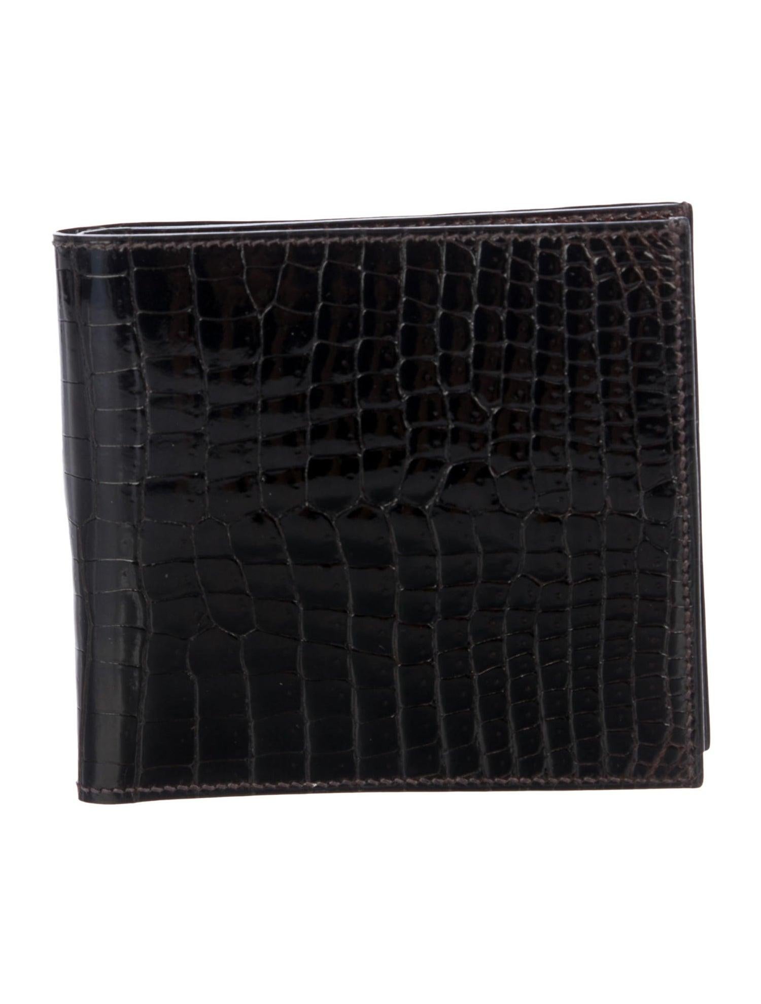 Hermes NEW Crocodile Exotic Leather Men's Suit Bifold Bifold Pocket Wallet 

Crocodile
Leather lining
Fold over closure
Features six interior card slots, dual wall pockets and bill compartment 
Made in France
Measures 4.5