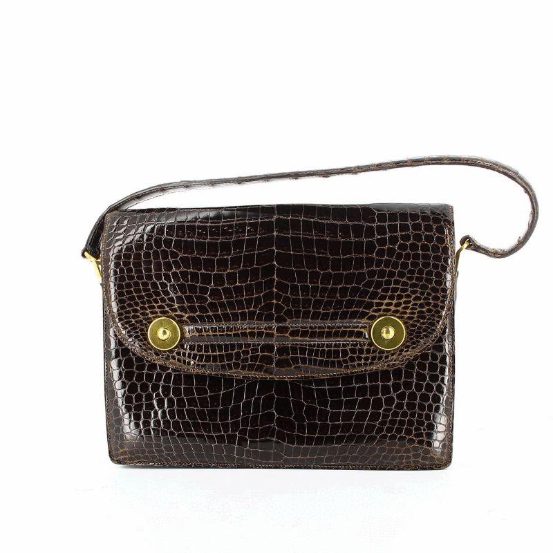 Hermes Crocodile Floride Bag

Brown leather, gold tone metal hardware
Very good condition, light signs of wear
Packaging:  Opulence Vintage dust bag

Additional information:
Designer: Hermes
Dimensions:  Height 21 cm / 8 1⁄2