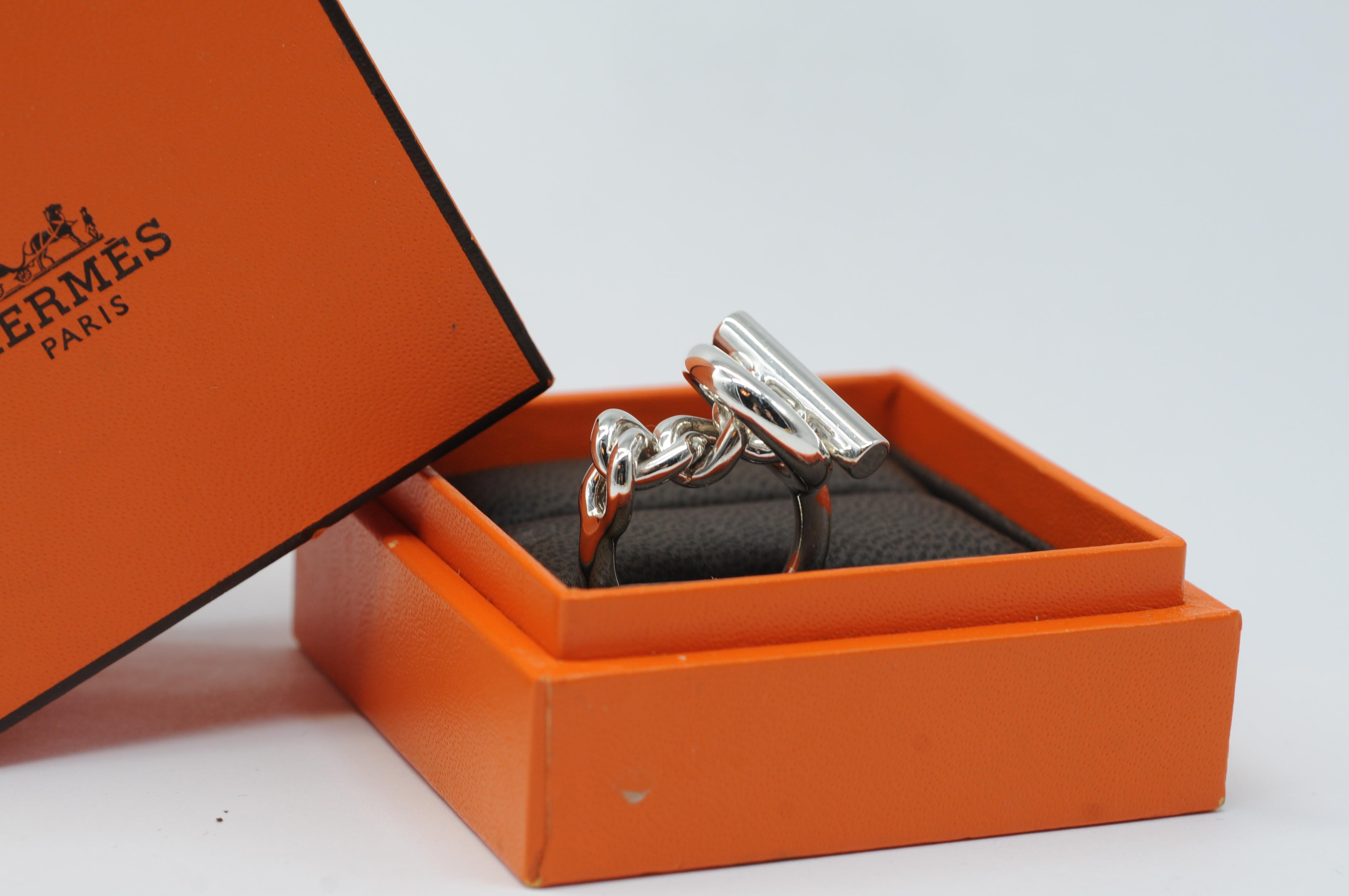Introducing the mesmerizing Croissete silver ring by Hermes, a true embodiment of elegance and style. This beautiful, solid ring has been freshly polished and is in excellent condition, ready to adorn your hand with its timeless charm.

Crafted to