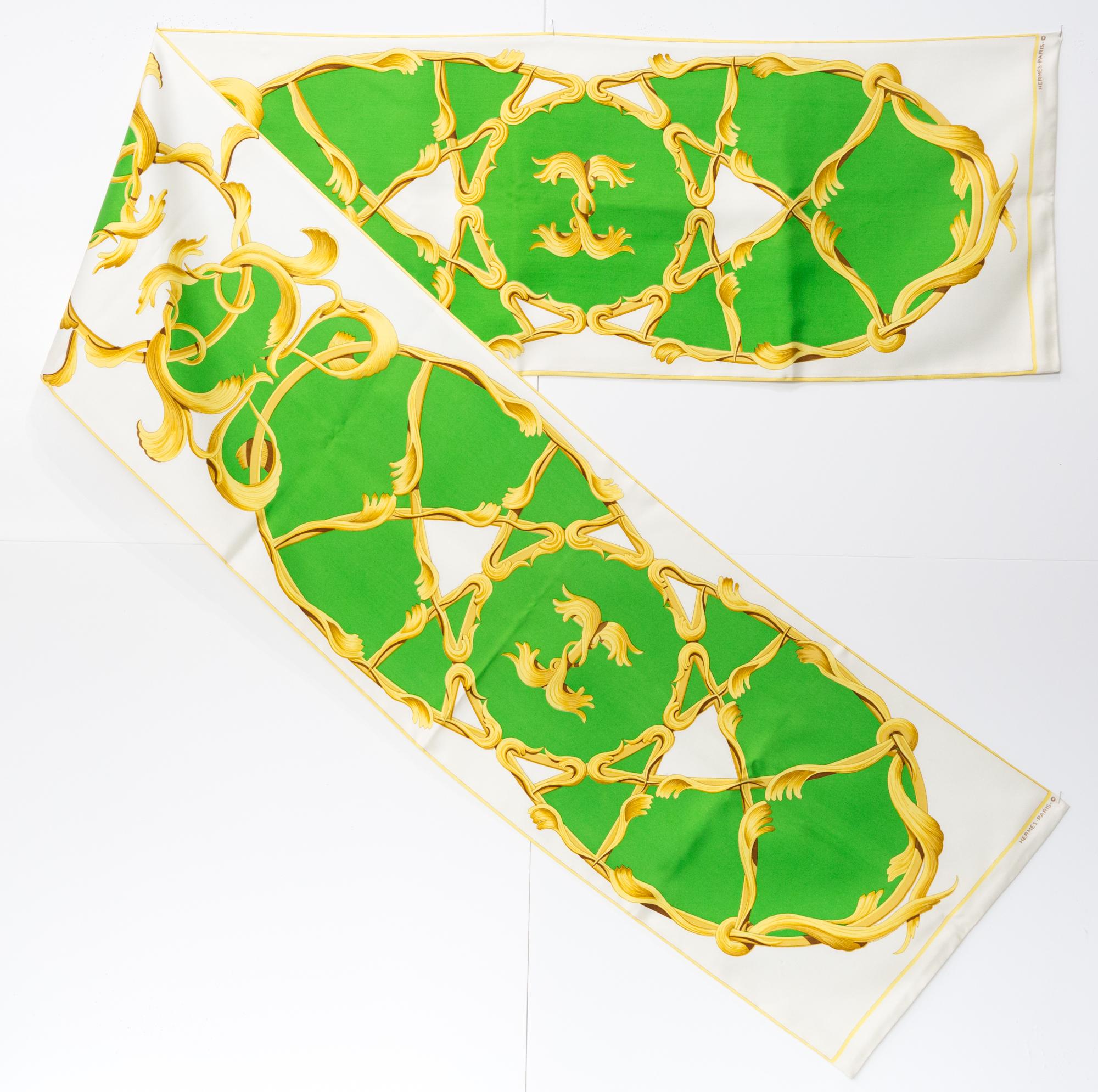Hermes long silk reversible scarf Couronnes by Julia Abadie featuring crowns on both sides, a Hermès signature at both sides. 
Designed by Julia Abadie in 1969
In good vintage condition. Made in France.
11.8in. (30cm)   X 73,2in (186cm)
We guarantee
