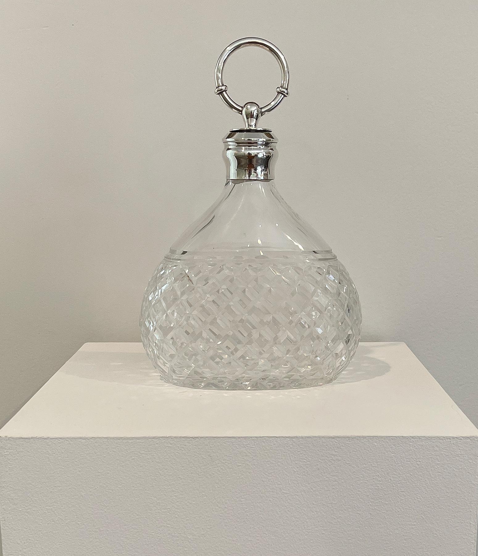 Hermes Paris

Beautiful crystal and silver decanter with a hoop sterling silver stopper covered with cork to keep alcool, airtight.
Impressed manufacturer's mark and touch marks to stopper for Hermès Paris.
Marked HERMES PARIS on crystal,