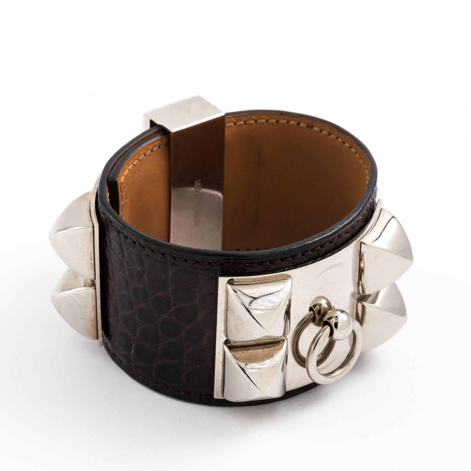 Contemporary Hermes Collier de Chien cuff bracelet that features a black alligator cuff with silver hardware. Size medium.
