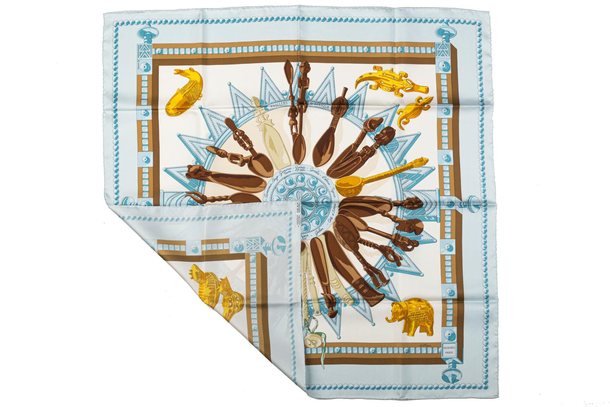 Hermès Cuillers d'Afrique light blue silk scarf by Latham. Dry clean only. Does not include box.